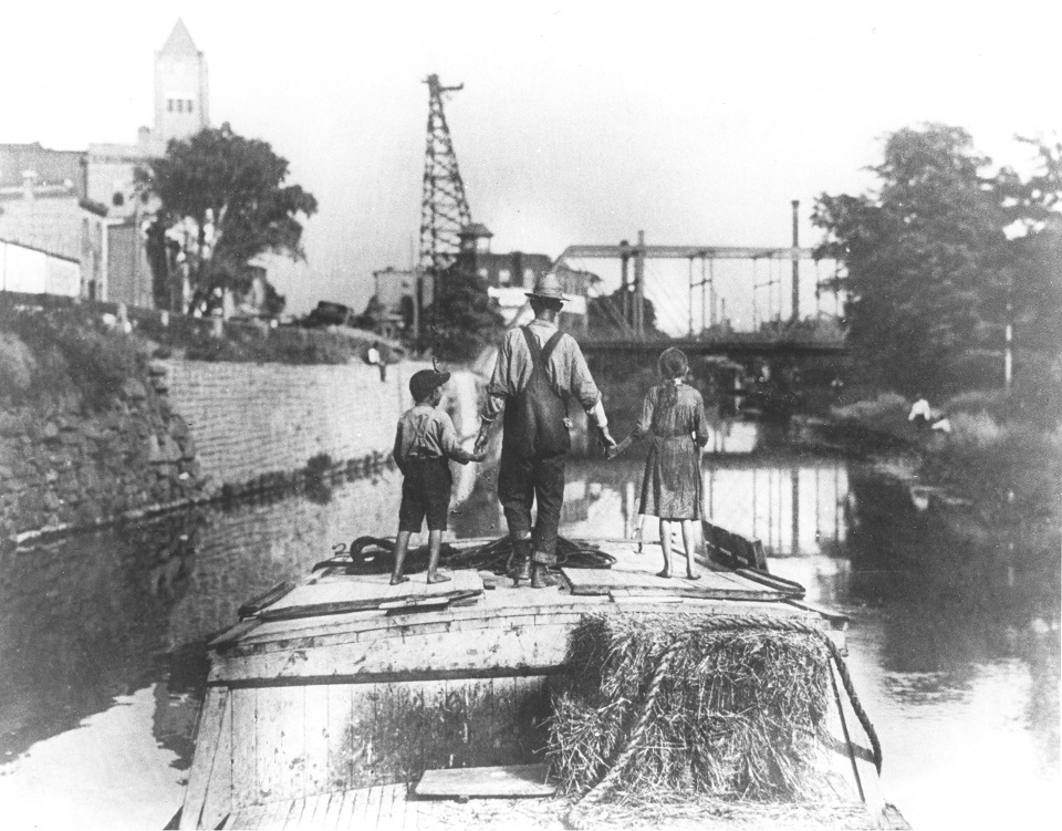 Father with kids on a canal boat