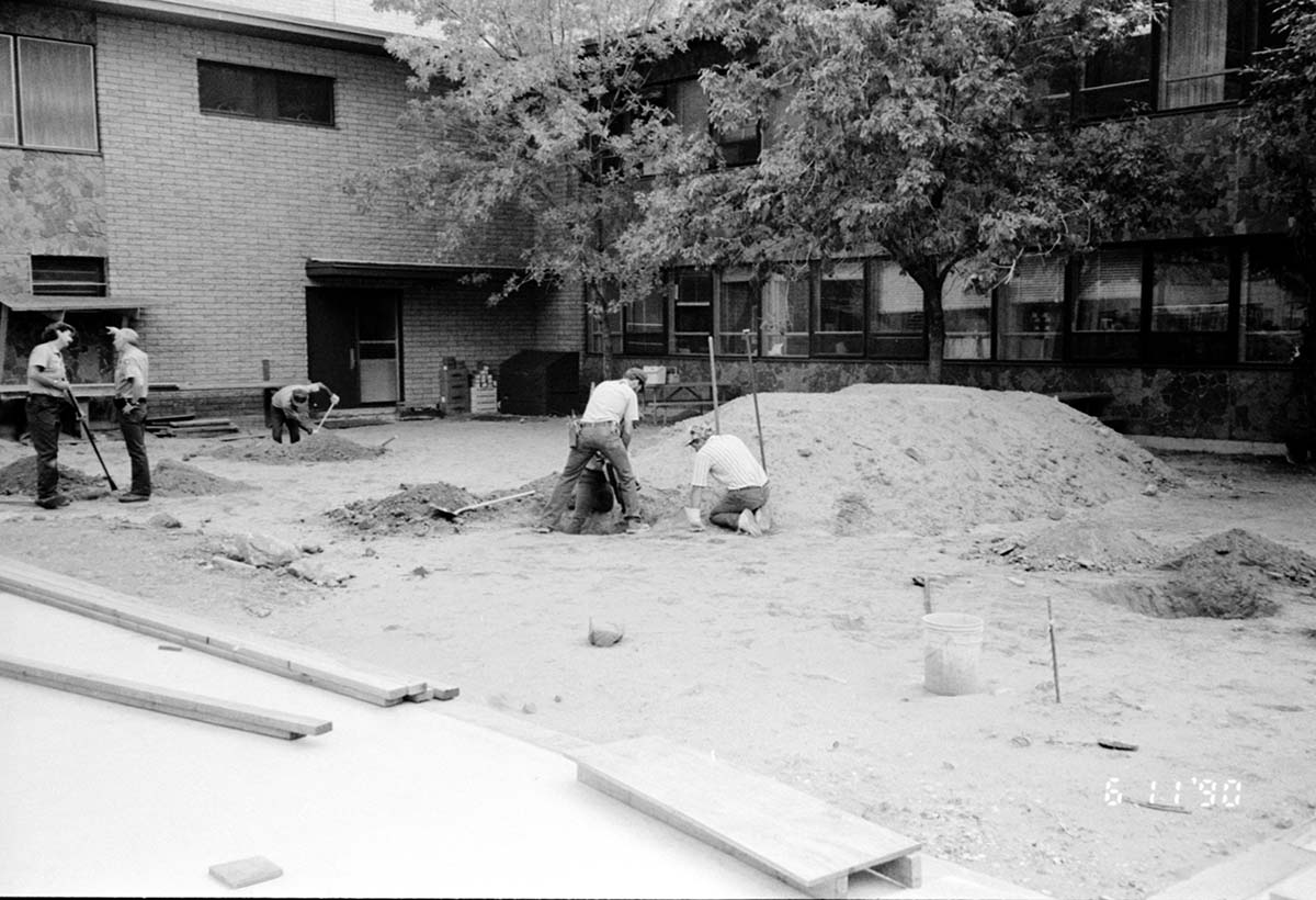 Workers working during the construction of headquarters addition.
