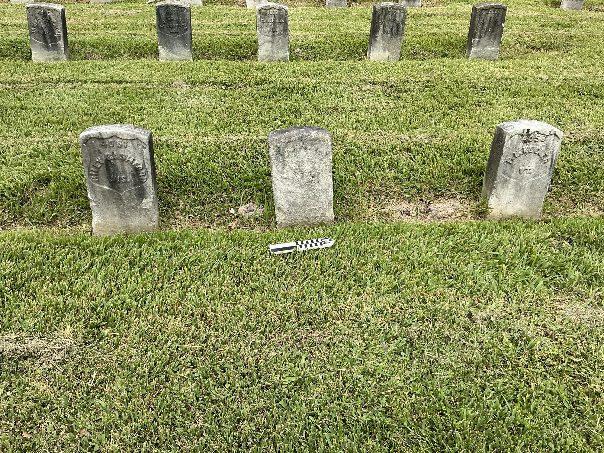 Extra image of historic upright marble headstone with recessed shield face.