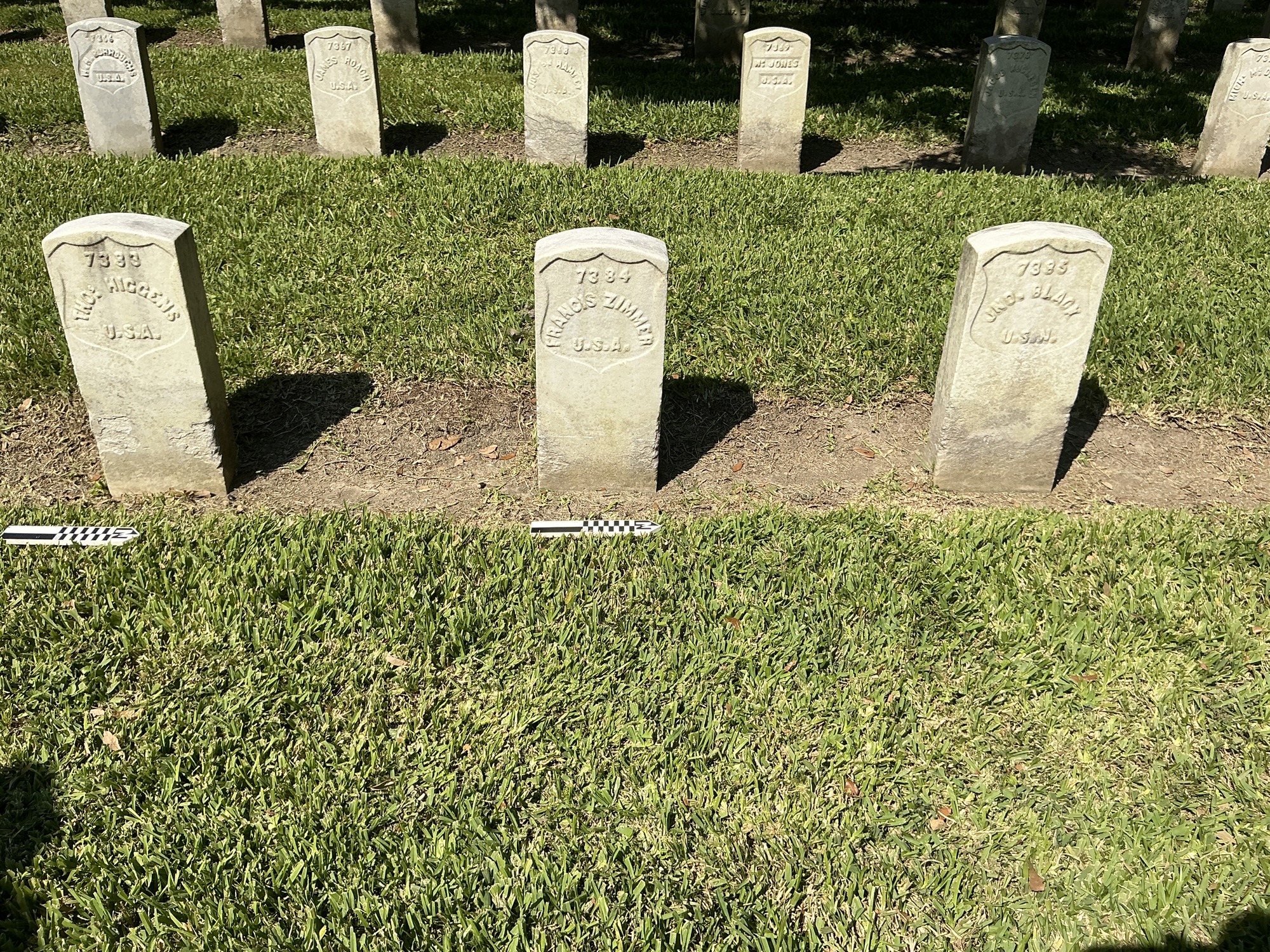 Extra image of historic upright marble headstone with recessed shield face.