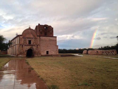 mission church with rainbow to the right