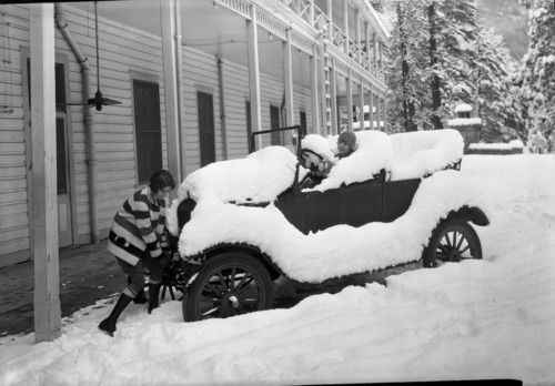 Copy Neg: Leroy Radanovich, August 1999. Kathryn McFarland and Ann Morris. Model T buried in snow in front of the Sentinel Hotel, Yosemite Valley.