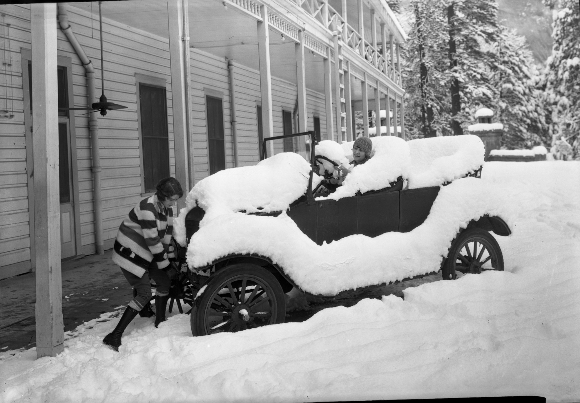 Copy Neg: Leroy Radanovich, August 1999. Kathryn McFarland and Ann Morris. Model T buried in snow in front of the Sentinel Hotel, Yosemite Valley.