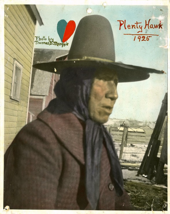 Plenty Hawk in Profile Wearing a Hat