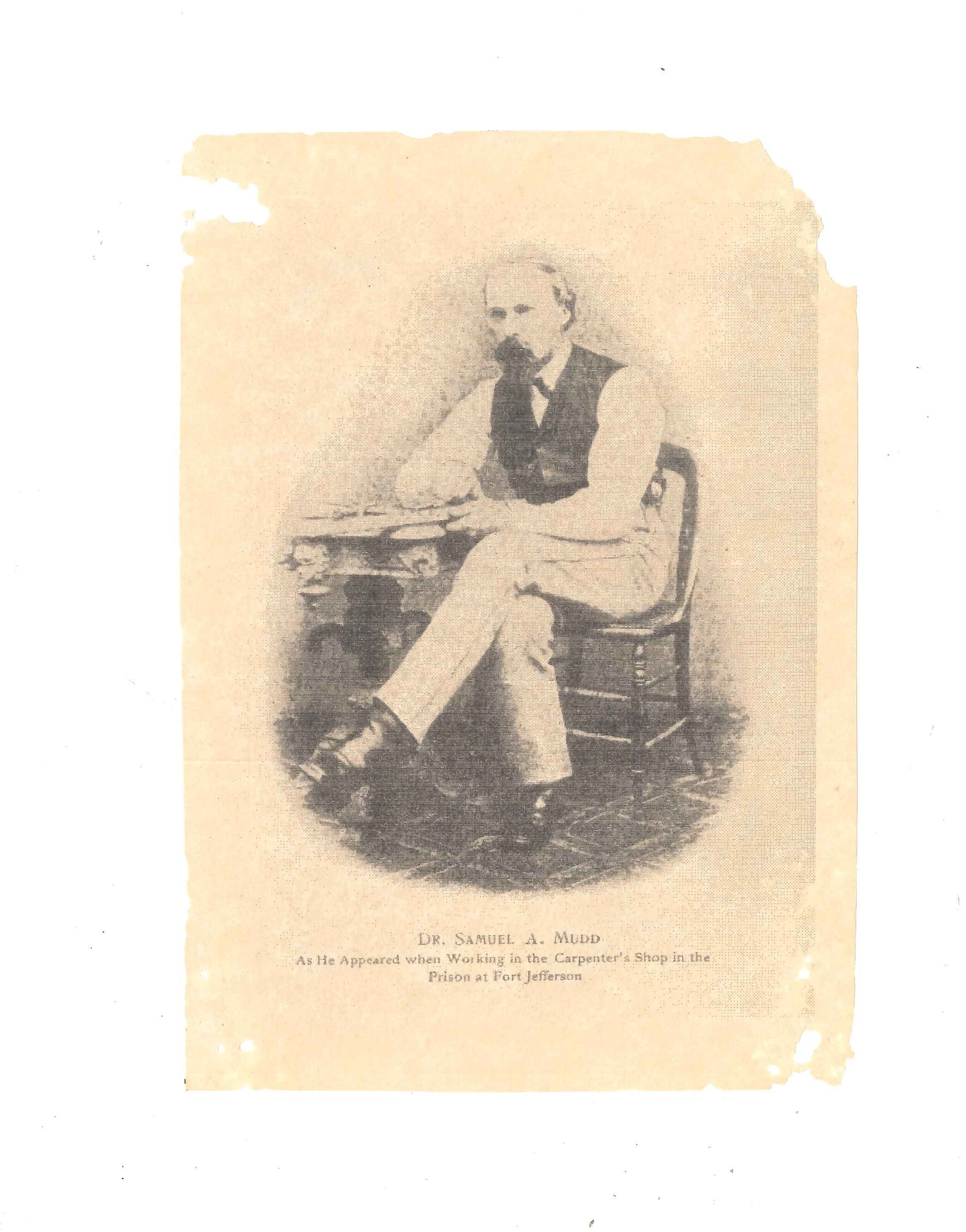 One scan of a photograph of Dr. Samuel Mudd sitting, with his arm resting on a small desk, with typed caption, “DR. SAMUEL A. MUDD As He Appeared when Working in the Carpenter’s Shop in the Prison at Fort Jefferson.” 