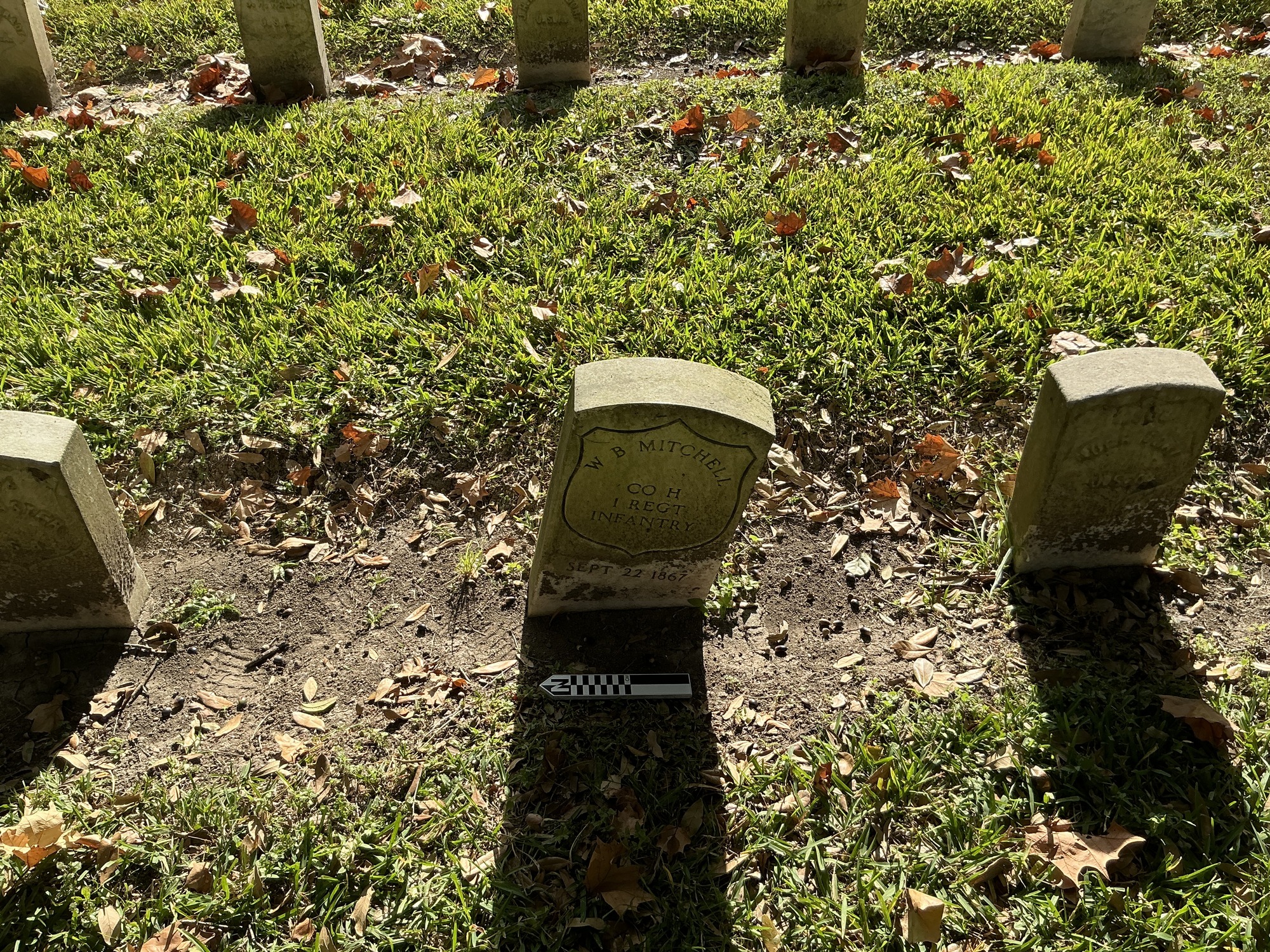Extra image of historic upright marble headstone with recessed shield face.