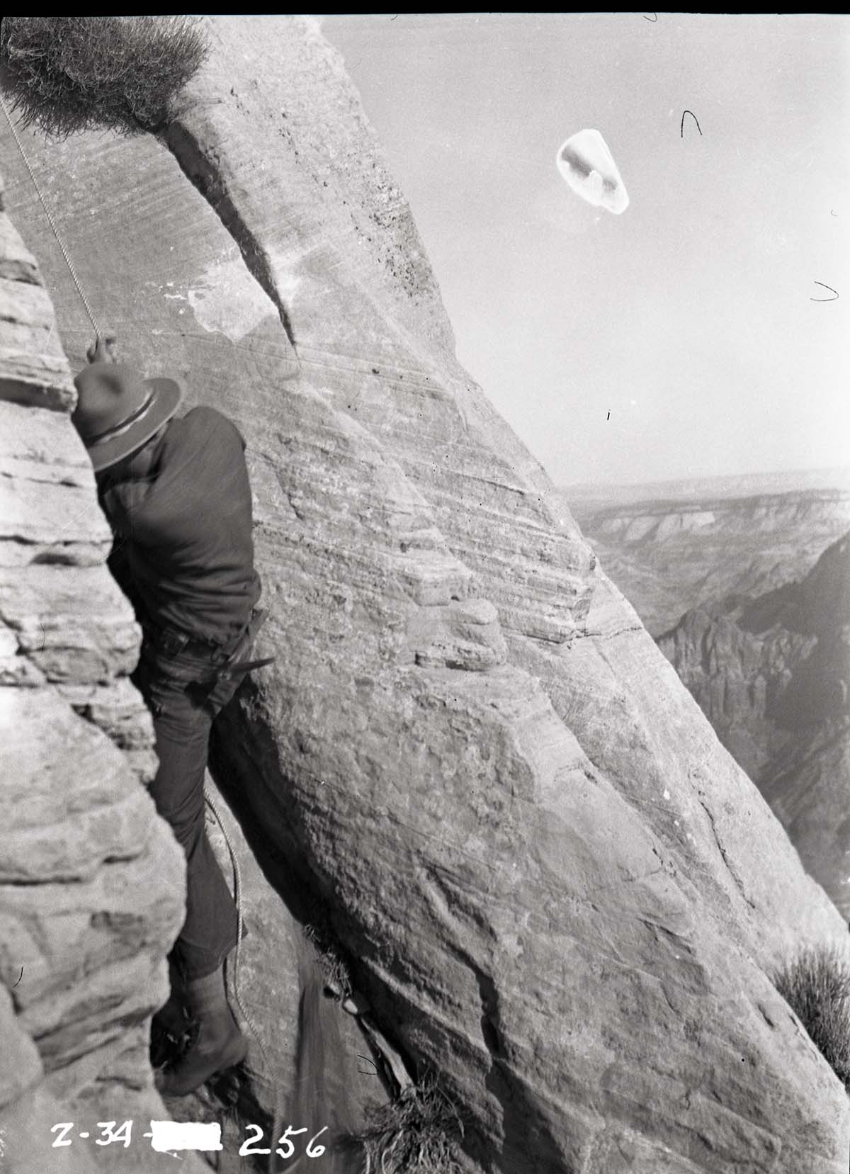 Crack where West Temple climb was made, close-up of ranger in crack.