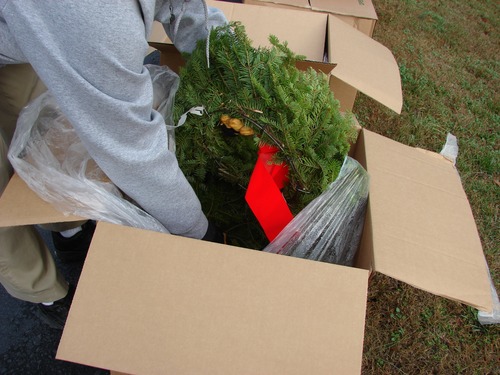 Unpacking the wreaths.