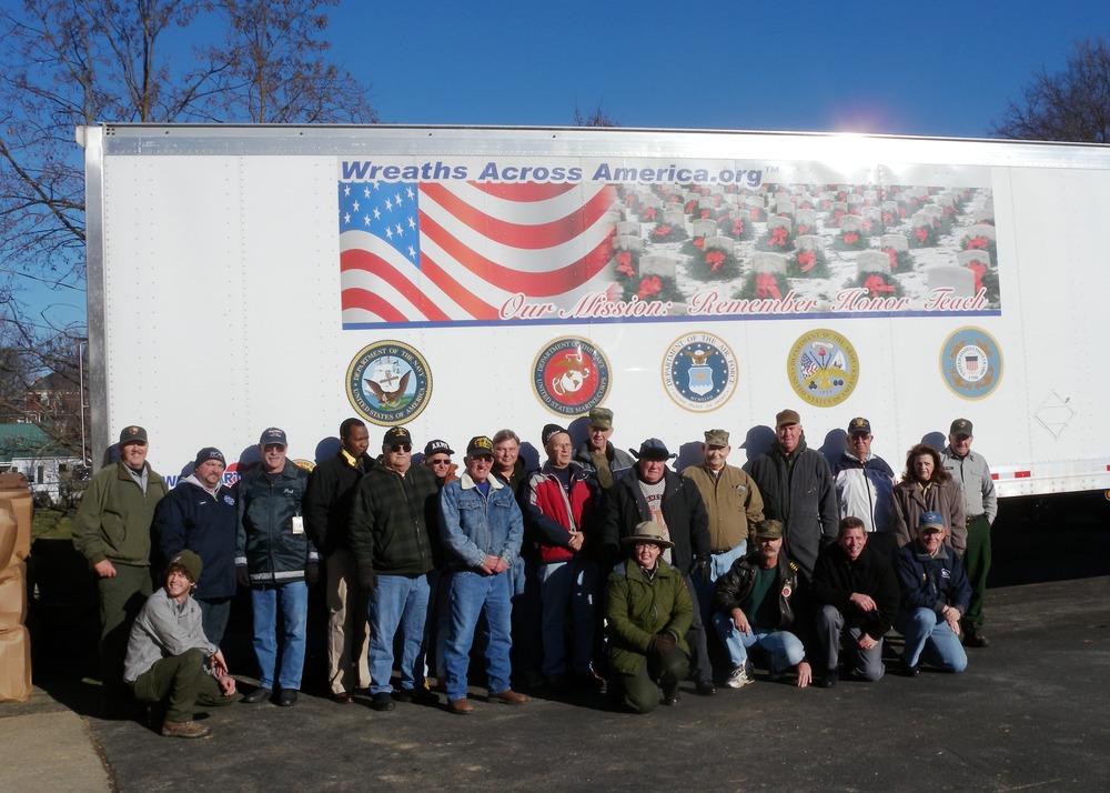 Andrew Johnson staff with veterans after unloading the wreaths from the Wal-Mart delivery truck