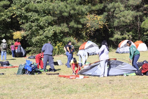 First time campers pack up there gear after a night at Hyde Farm.