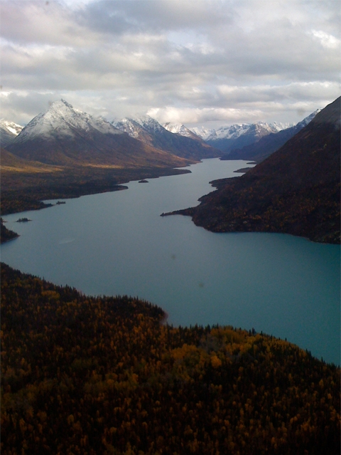 a large, l-shaped lake with steep mountains on either side