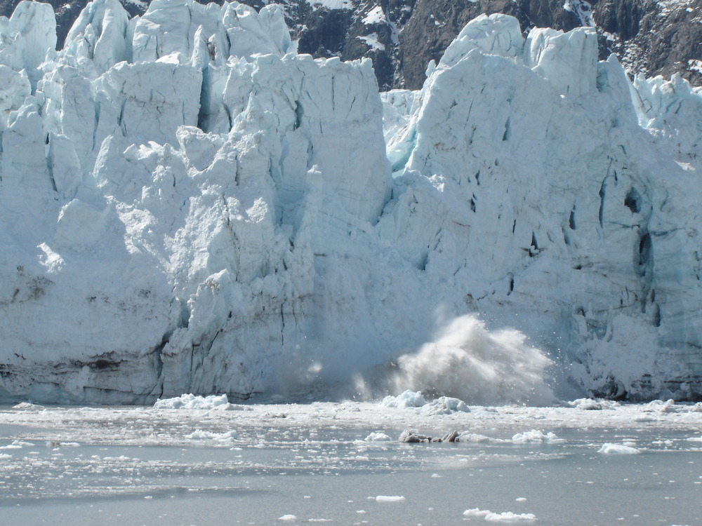 Large chunk of ice breaking off a glacier