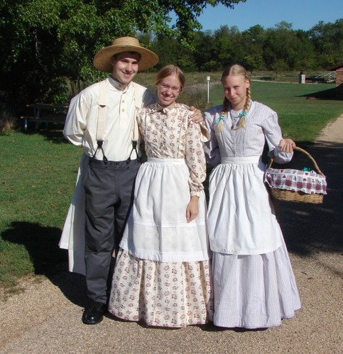 Park volunteers:  one man and two women dressed in period clothing. 