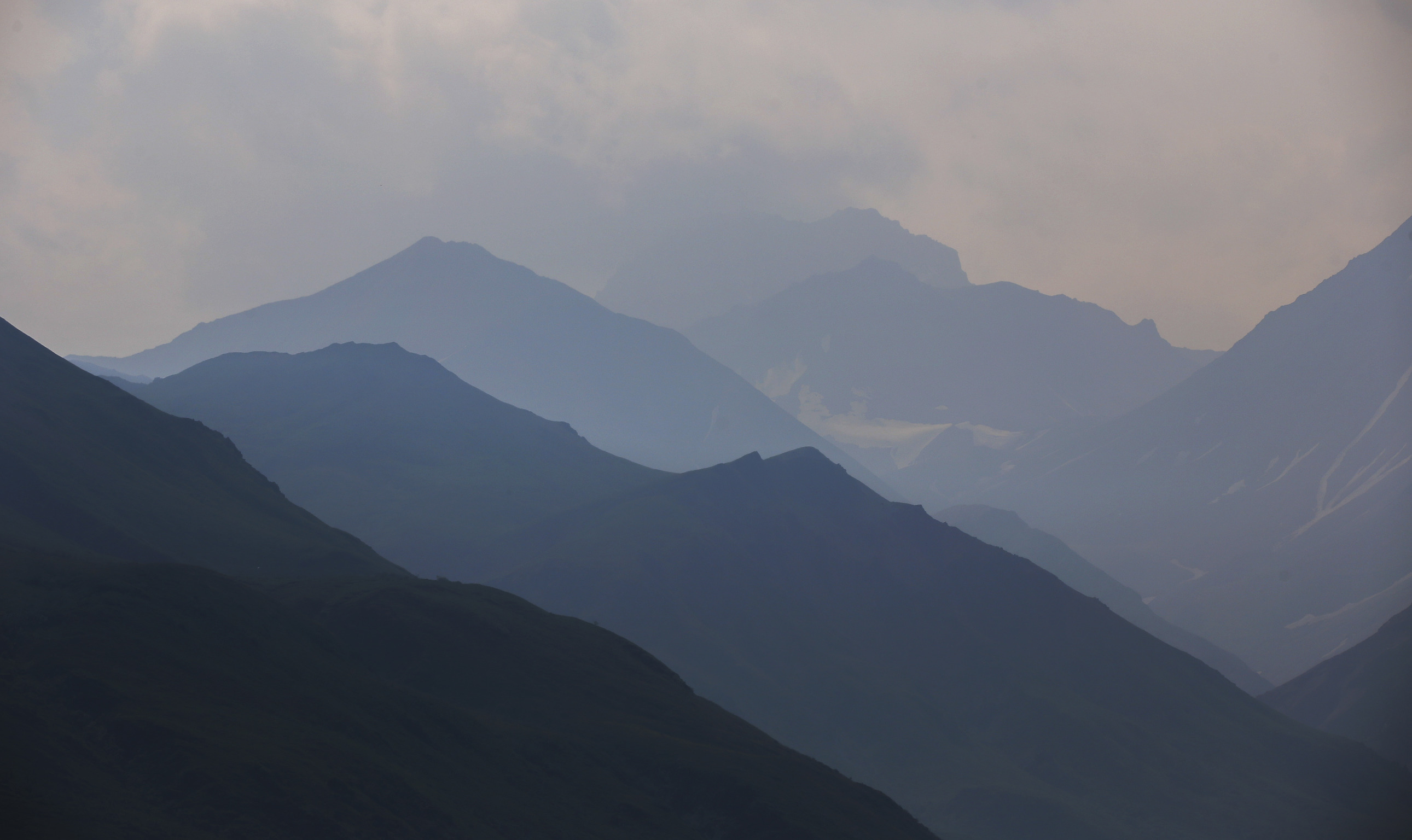 mountains partially obscured by thick smoke