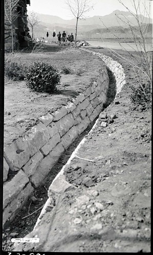 Construction of irrigation ditches in front of cafeteria, Camp Center, South Entrance.