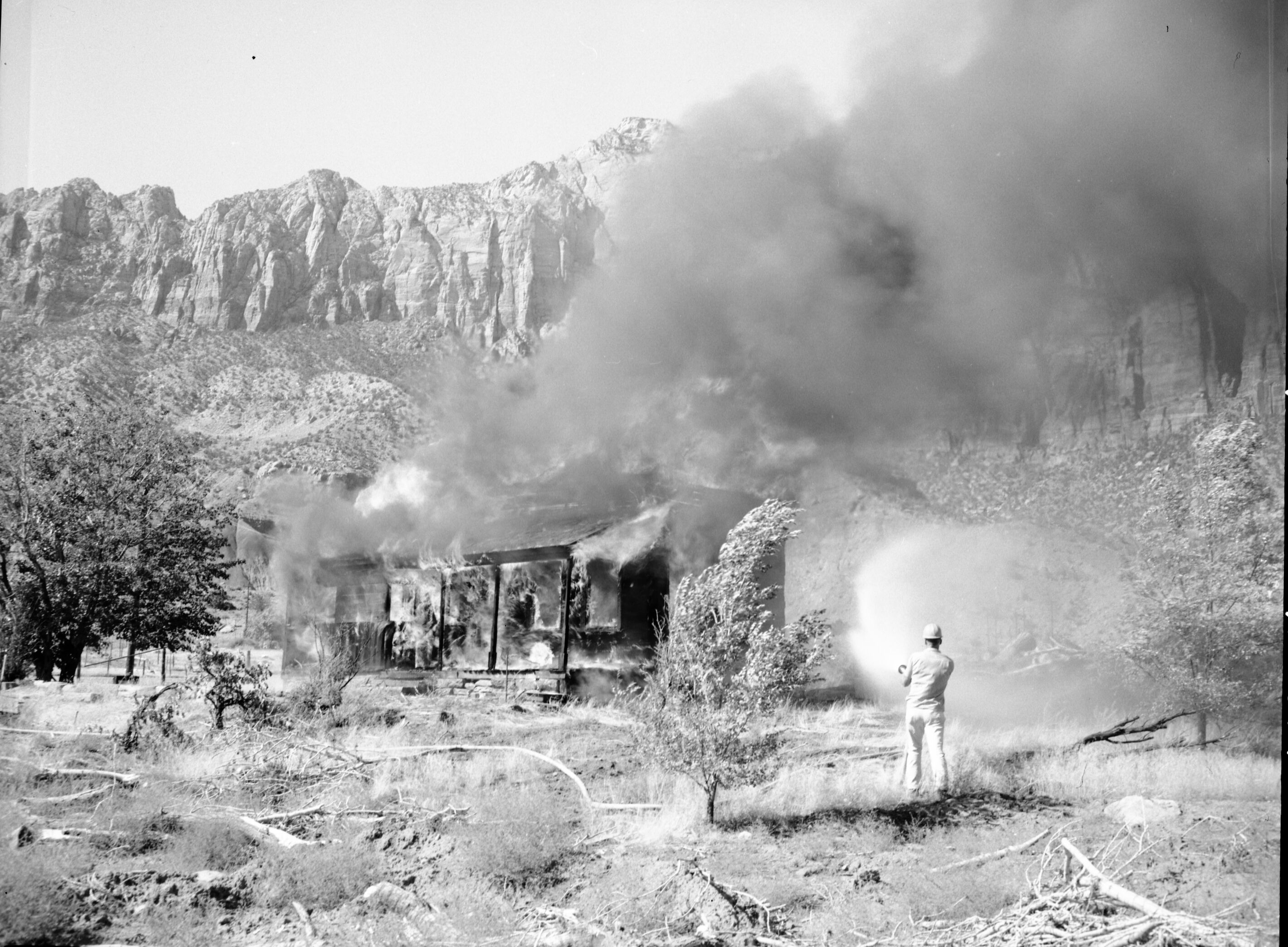 Fire prevention training; demonstration for students of Springdale school. Burning of old Justet home adjacent to Springdale school.