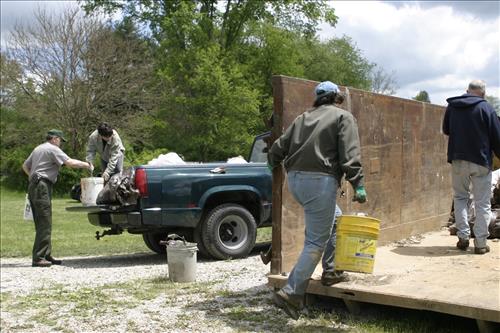 RiverDay trash clean up staff and volunteers at dumpster