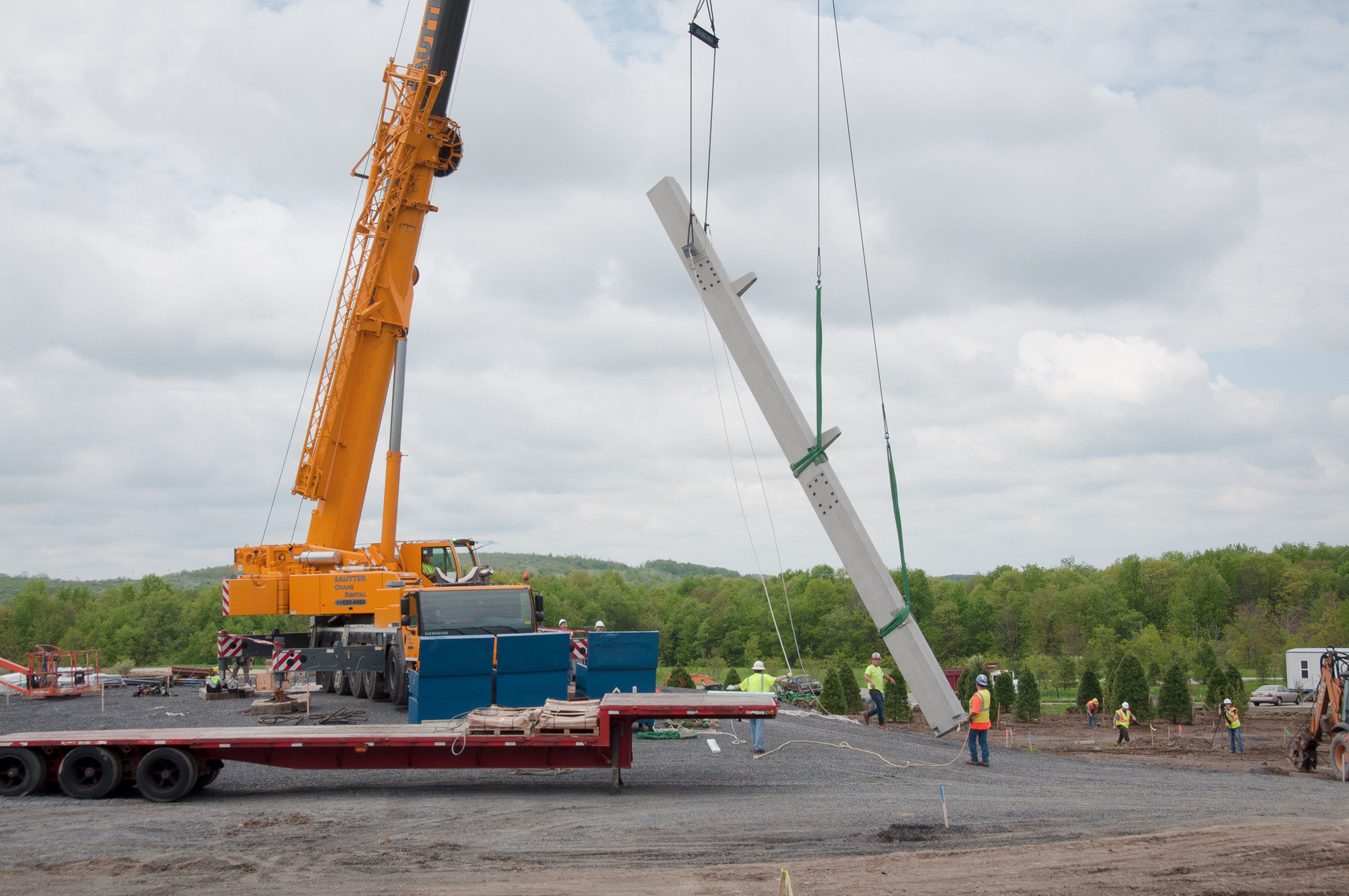 Crane helps set the first leg of the Tower of Voices. 