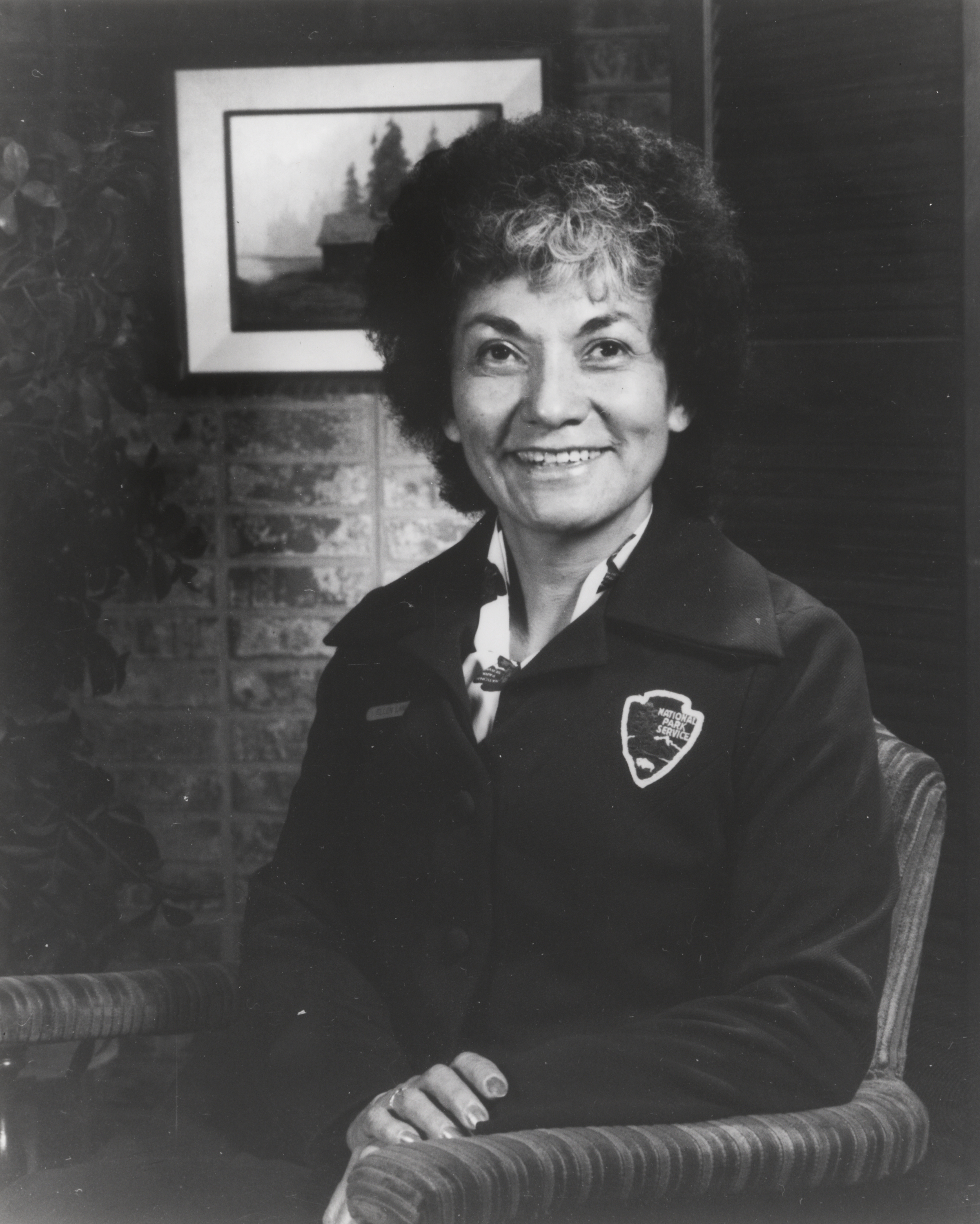 Ellen Lang poses in her NPS uniform, smiling at the camera. 