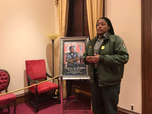 Ranger talking next to a portrait of Mary McLeod Bethune