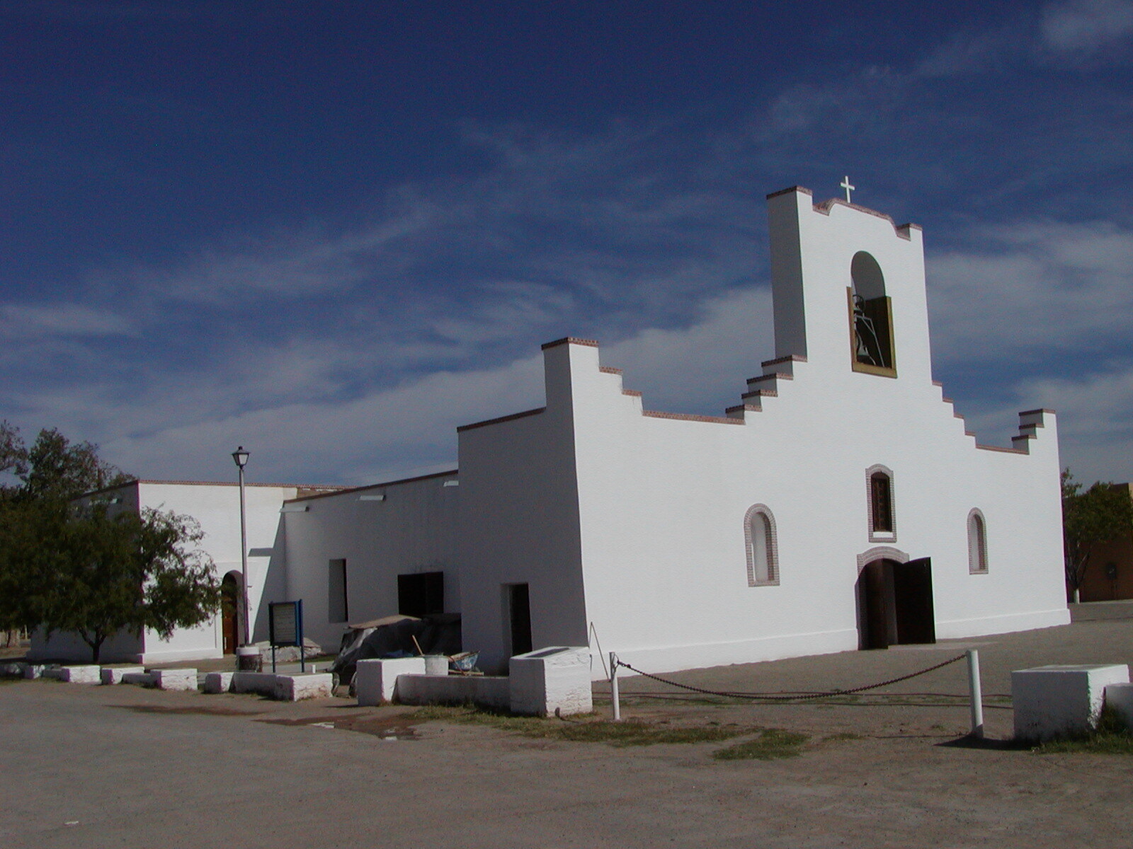 A side view from the parking lot at the Socorro Mission in Socorro, TX