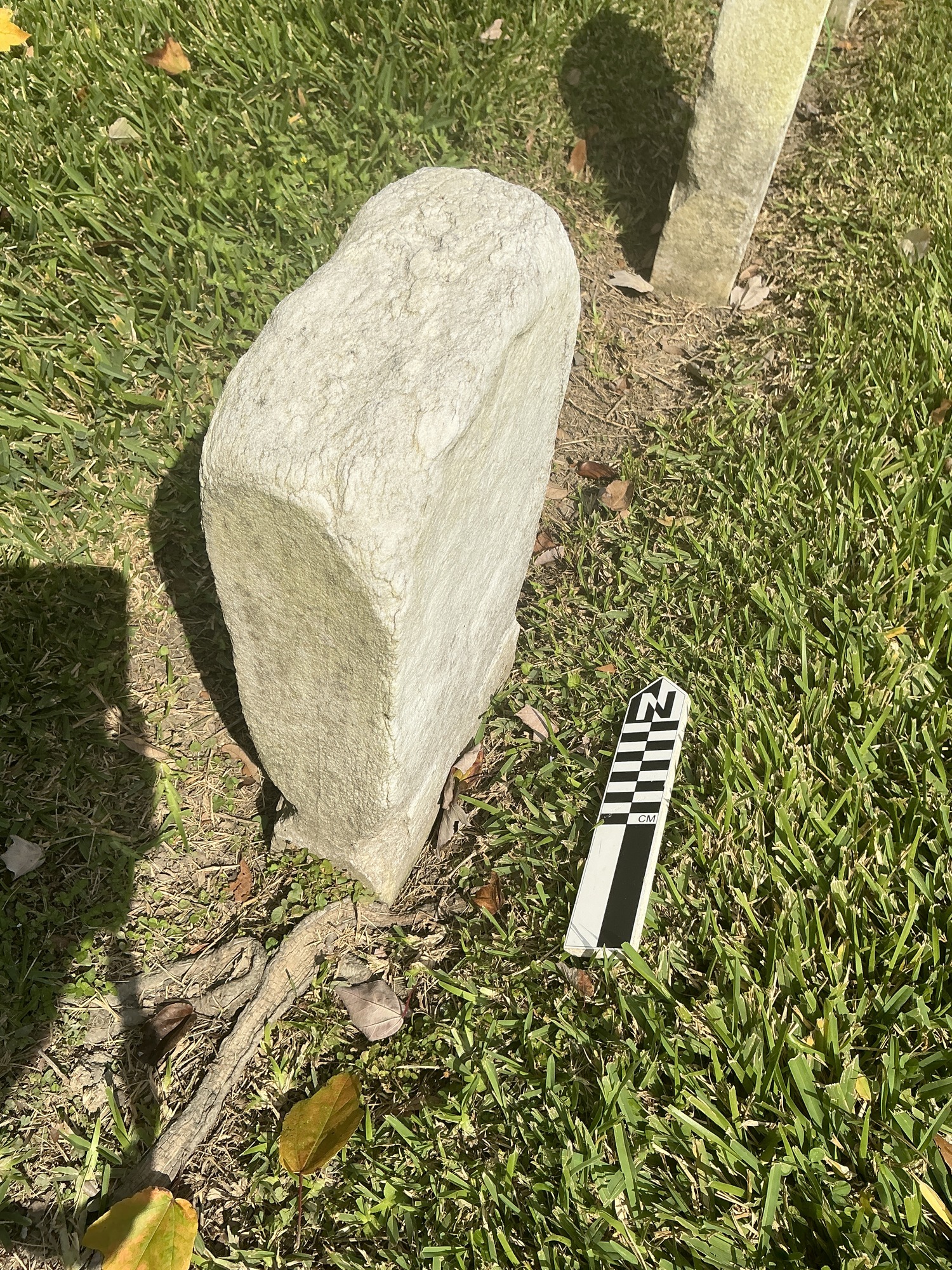 Extra image of historic upright marble headstone with recessed shield face.