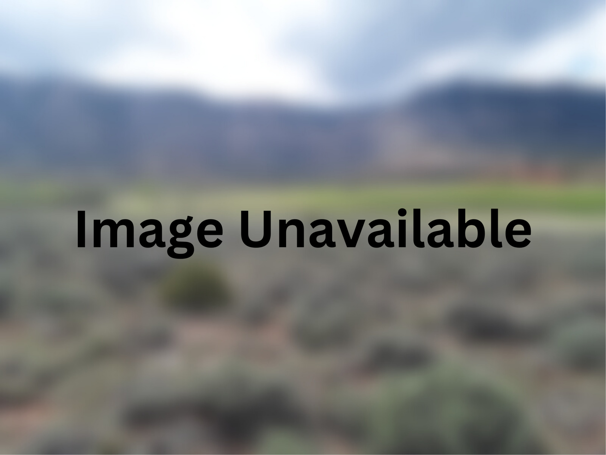 Blurred landscape background with overlain text "Image Unavailable"