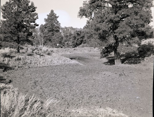 Illegally constructed water reservoir on government property in Hop Valley. Park service vehicle and James Felton in distance.