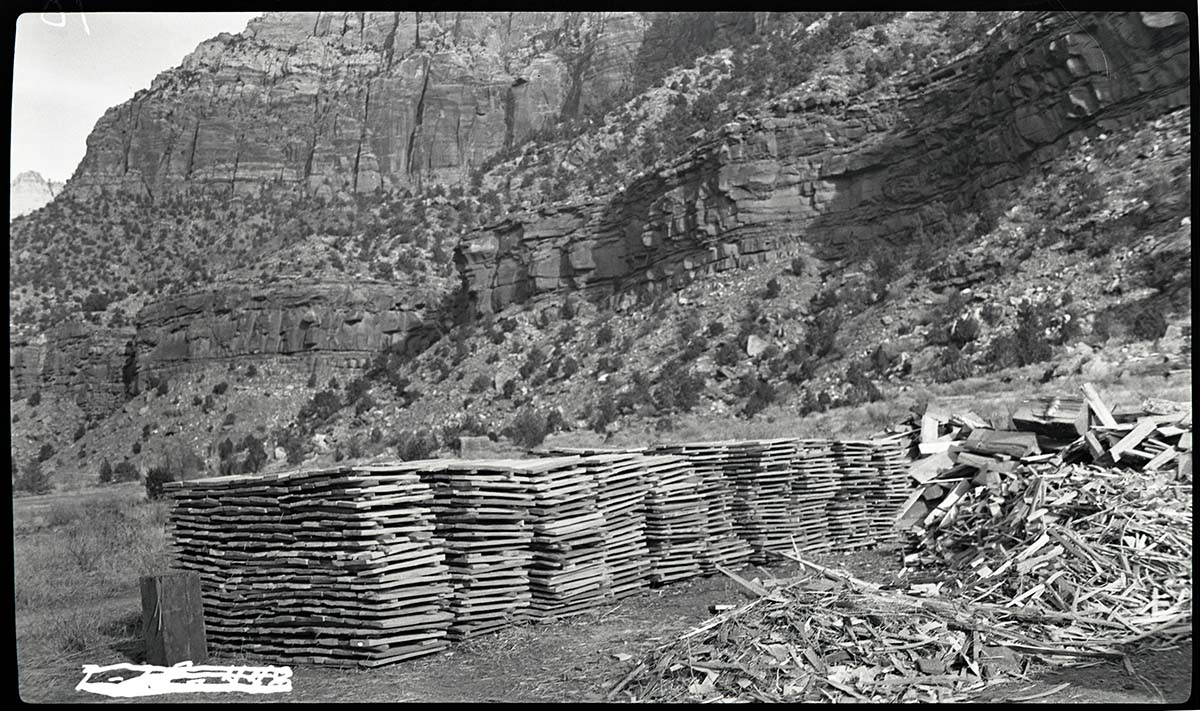 Stacked bundles of shakes made by Civilian Conservation Corps (CCC) workers for use on the roof of the administration building, Oak Creek.