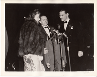 Madeleine Edison Sloane and her family and unidentified man at microphones at premiere of 