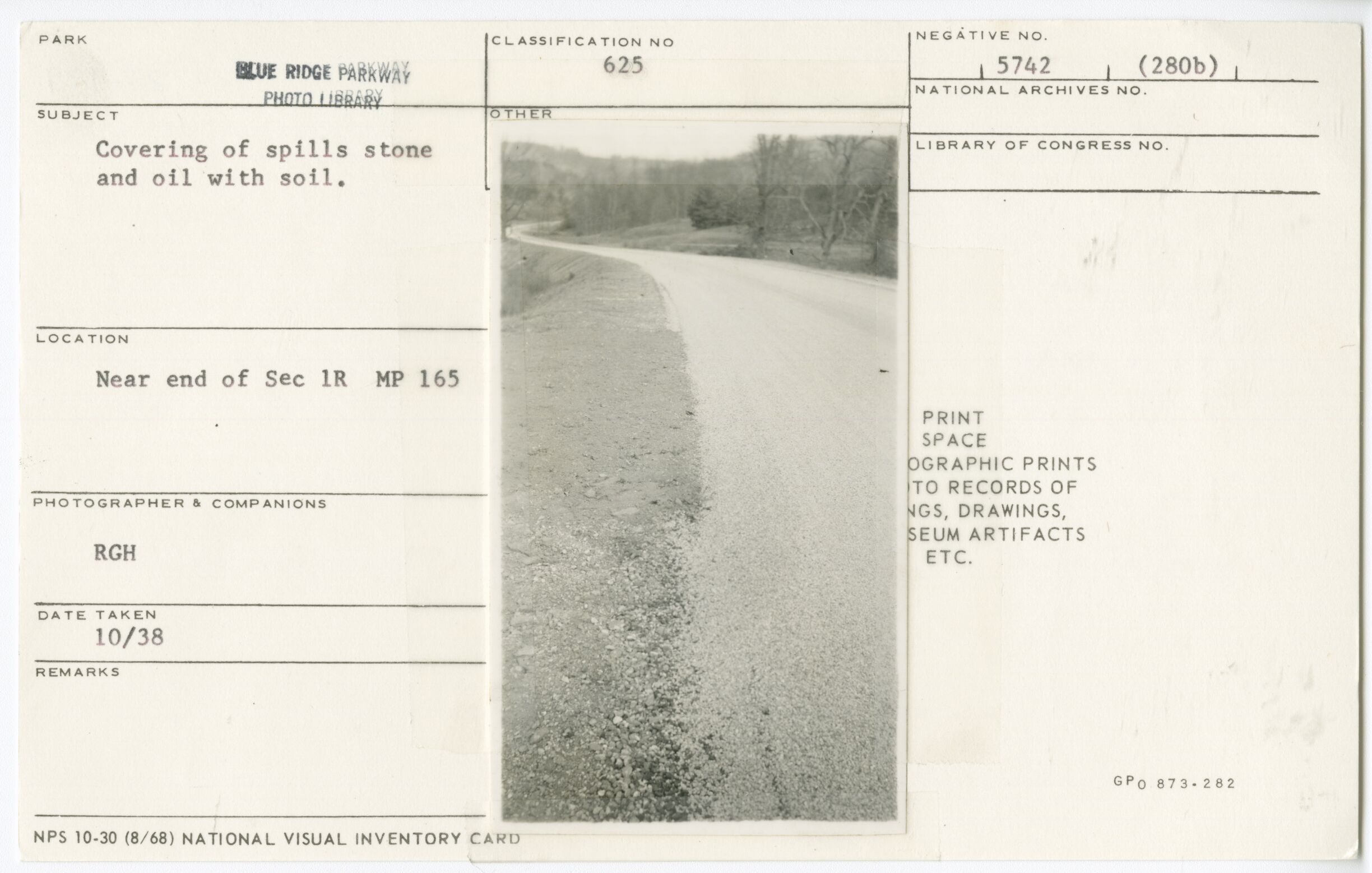 Covering of spills stone and oil with soil