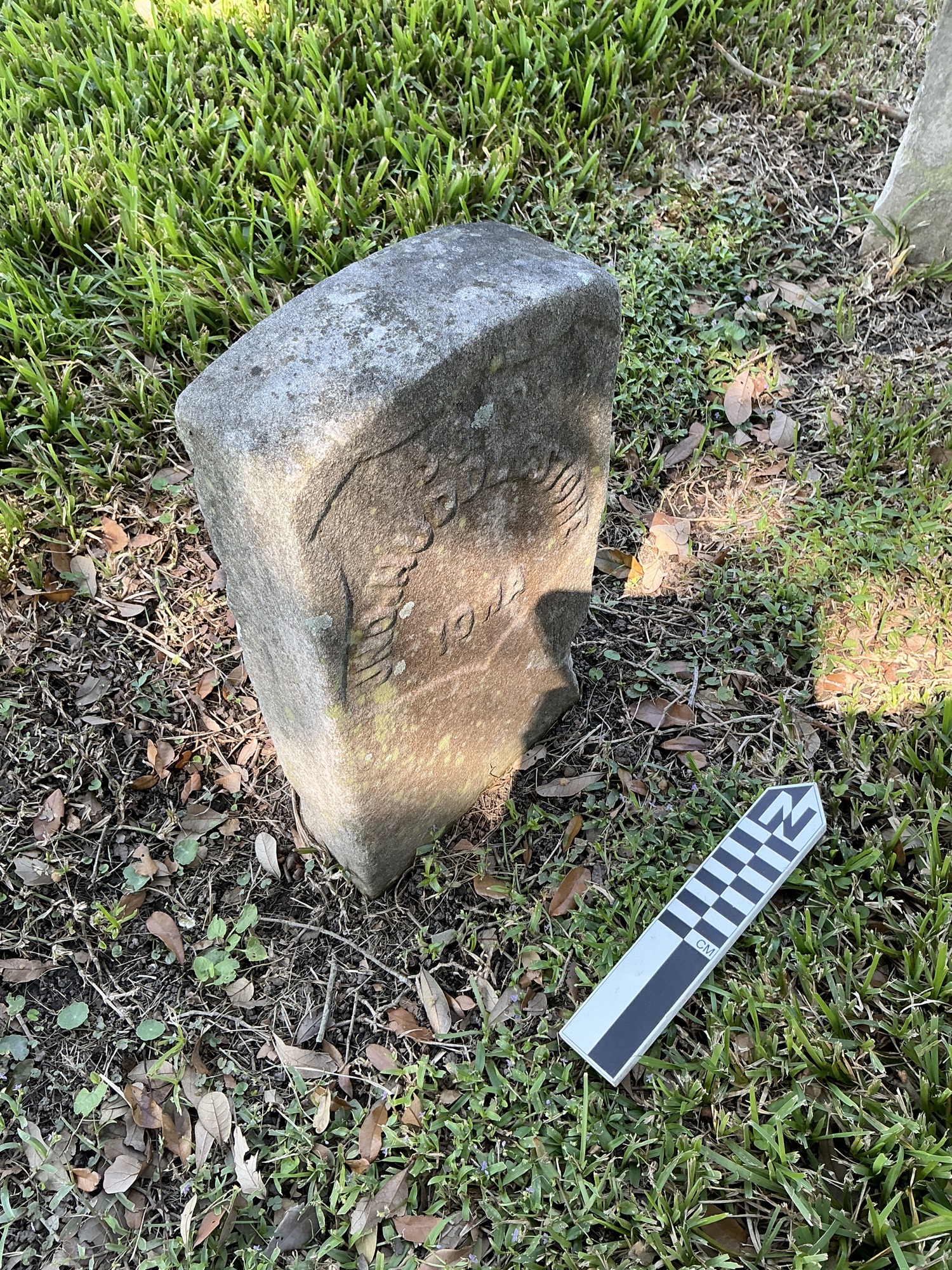 Extra image of historic upright marble headstone with recessed shield face.
