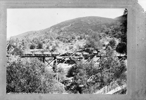William Stevenson original. Coulterville locomotive pulling ore from the Mar Harrison to the mill about 3 miles down the railroad. copied by Ralph H. Anderson