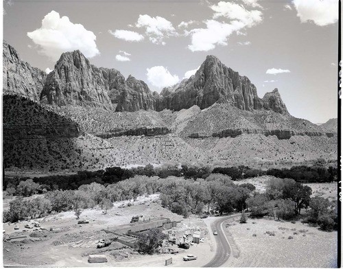 General overview and view of Mission 66 Visitor Center and Museum construction, the Watchman in background.