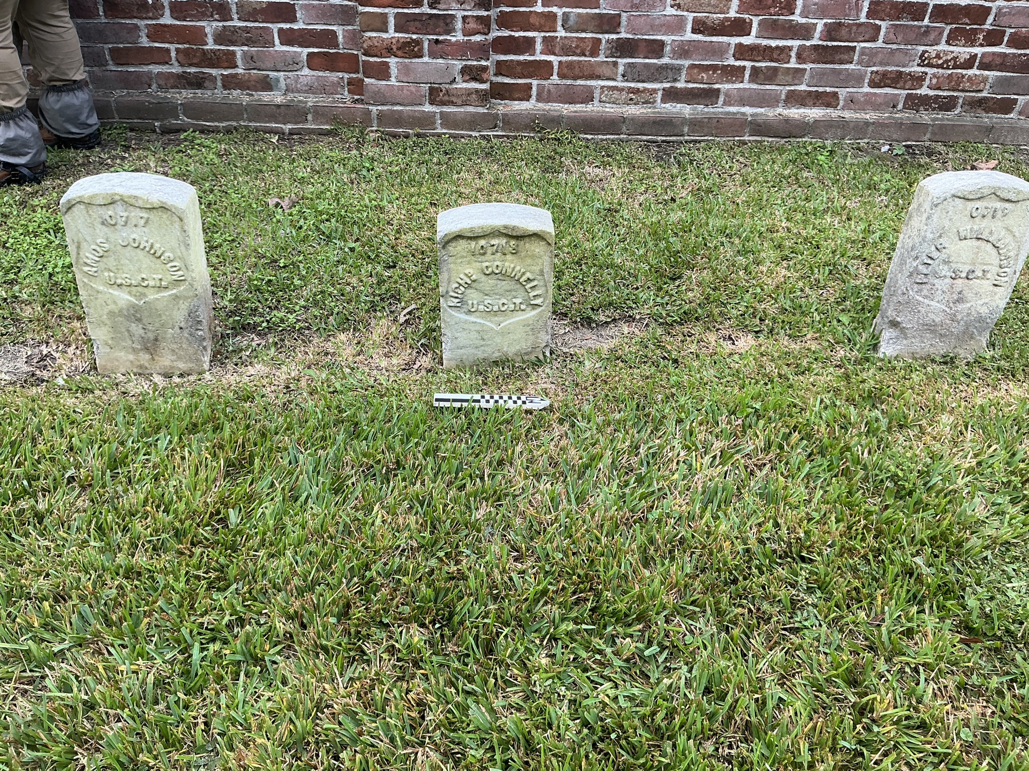 Extra image of historic upright marble headstone with recessed shield face.