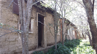 long, low-slung adobe house ruin
