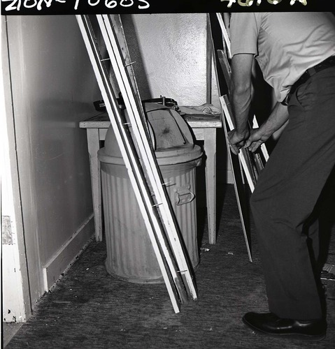 Damage to men's dorm at Zion Lodge, repair work on doors and walls.