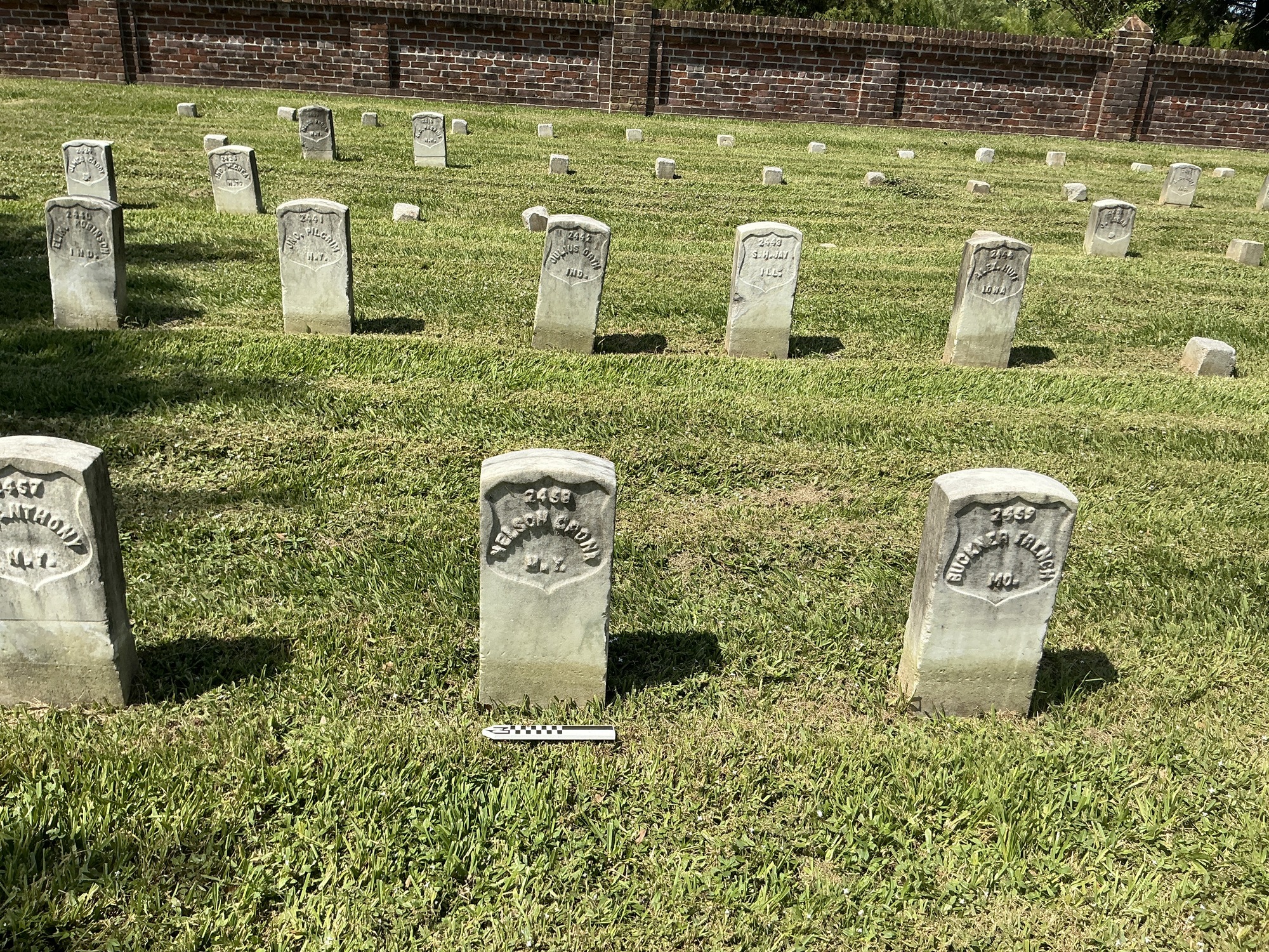 Extra image of historic upright marble headstone with recessed shield face.