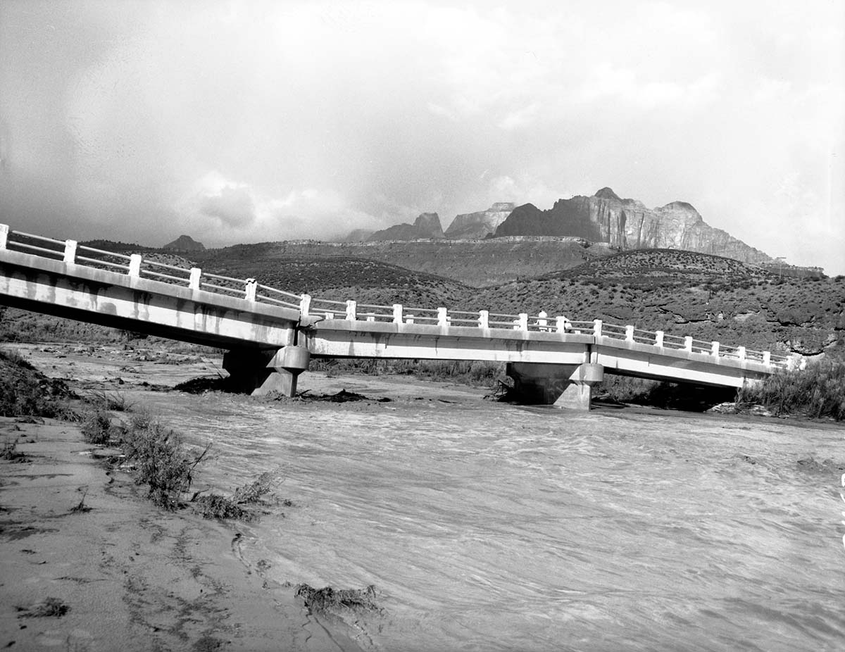 Partial collapse of Coal pits Wash bridge on State Route 15 (now State Route 9). This plus landslides down river closed the approach road to park for 24 hours. See ZION 8599, 8600, and 8601 also.