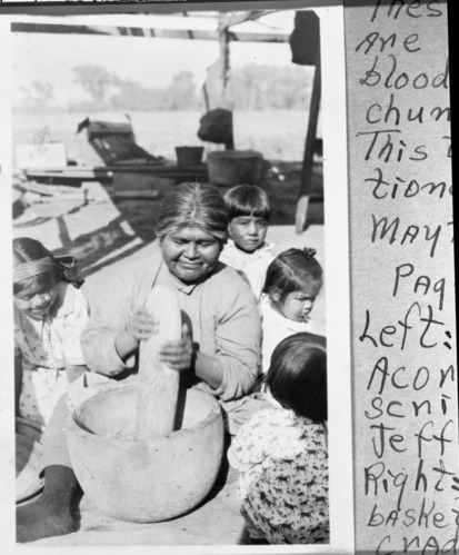 Copy Neg: April 2001, L. Radanovich. Maggie Icho, Wukchumne Yokuts with motar. Copied from the Frank Latta photo collection in the Yosemite Museum.