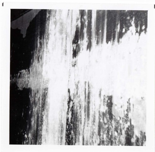 The interior of the 40000 gallon water tank showing buildup/corrosion.