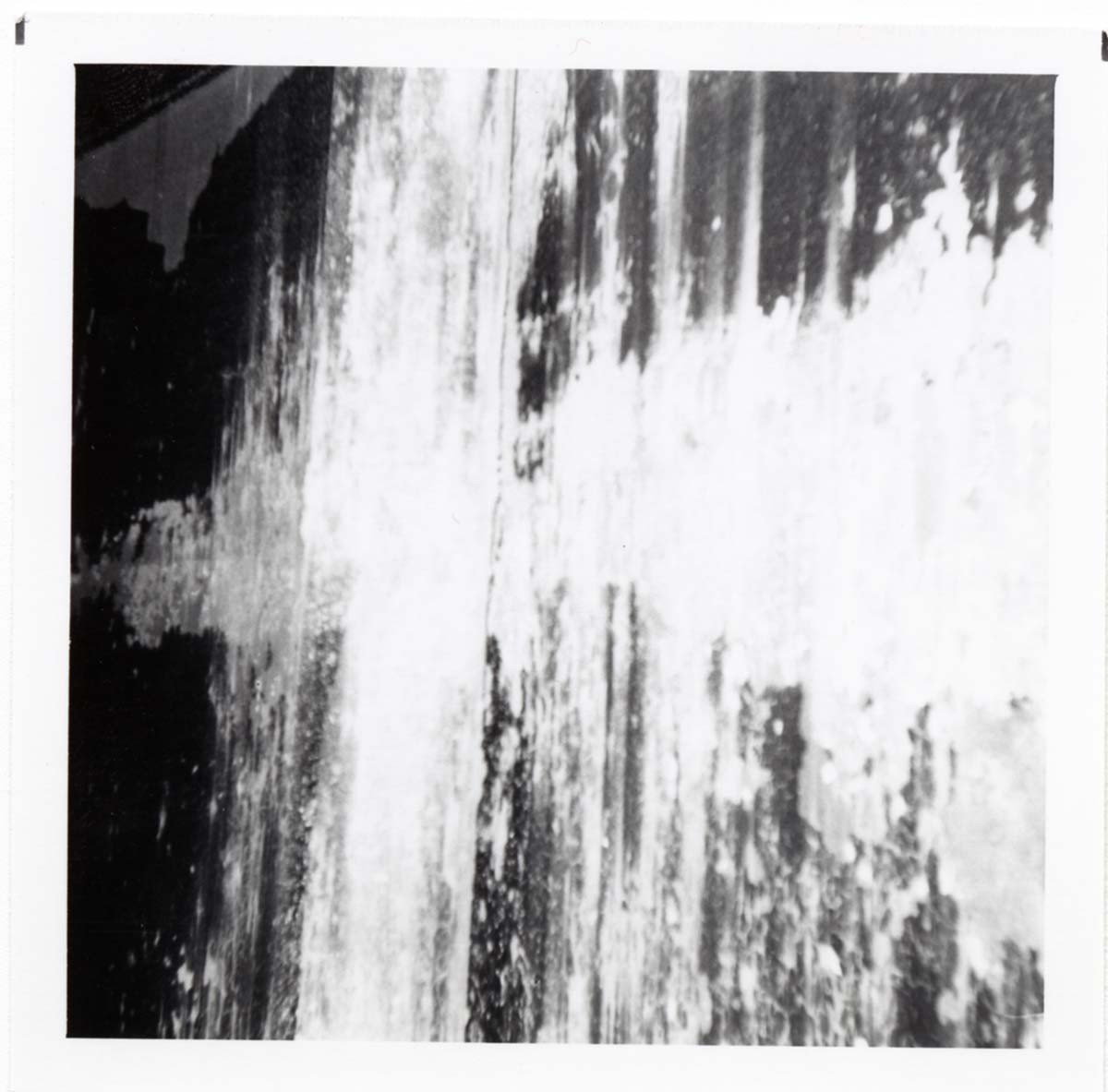 The interior of the 40000 gallon water tank showing buildup/corrosion.