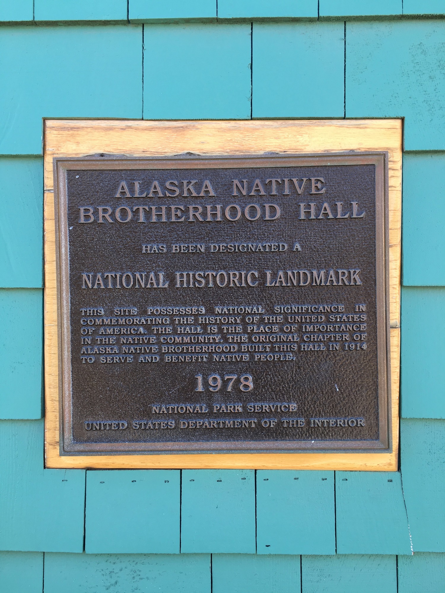 Alaska Native Brotherhood Hall National Historic Landmark Plaque hangs on the front of the hall.