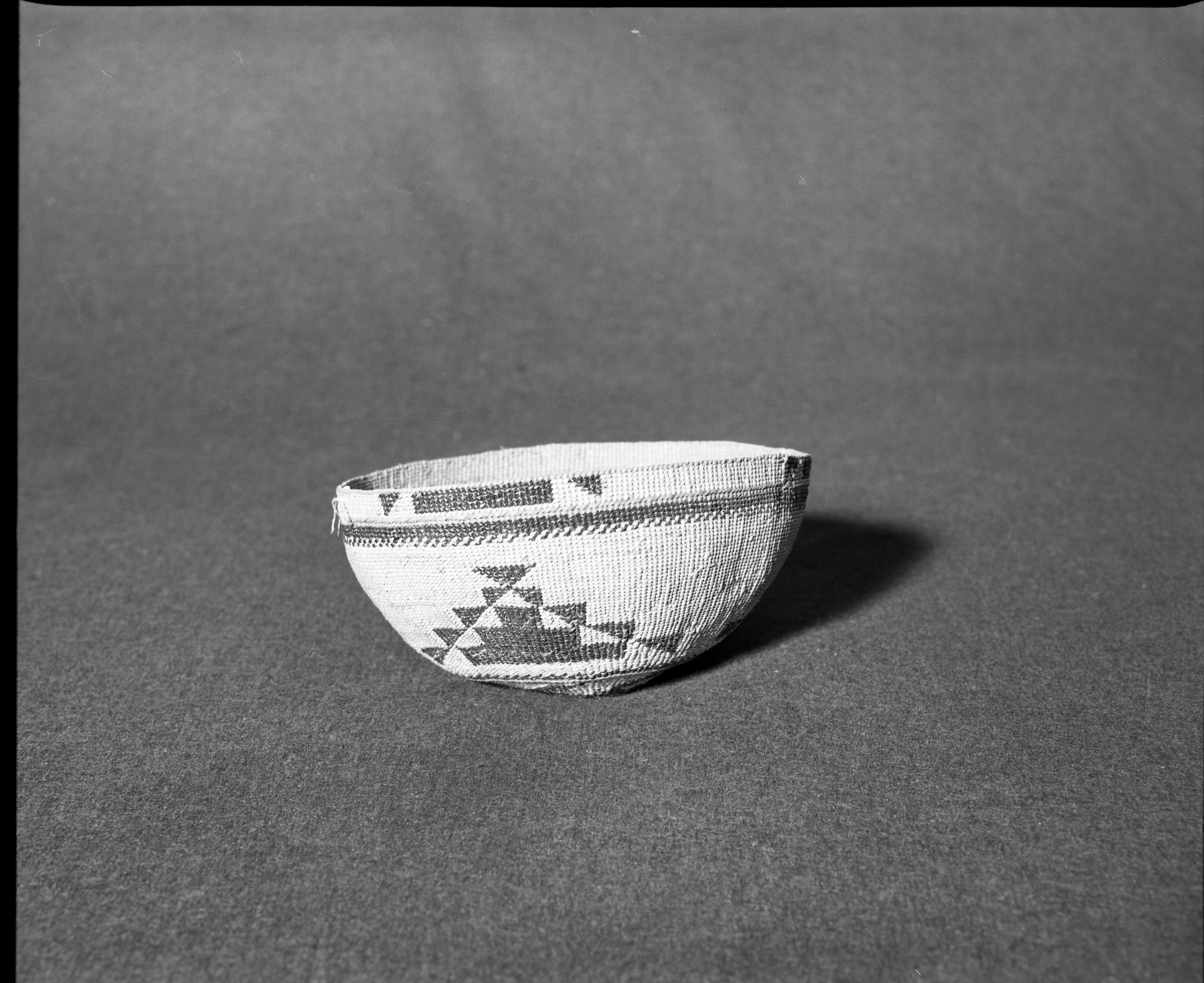 Marie Rozier Collection, Catalog No. 129. Object: Yurok/Karok/Hupa hat. Dimensions: 6 1/2 x 3". Materials: Maidenhair fern stem, beargrass, conifer root. Collection History: Mrs. Long Collection, collected between 1890 and 1910. Photographed by Michael Dixon in December 1982. Catalogued by Craig Bates and Barbara Beroza. Yosemite Collections, National Park Service.