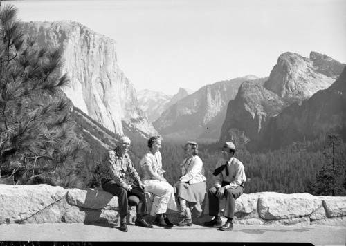 Left to right: Mr. Ralph Assheton, Mrs. Assheton, unidentified woman & Ranger Wayne Brynat, at Inspiration Point. Mr. Assheton is a Member of the British Parliament, a close friend of Winston Churchill, and a member of the Privy Council.