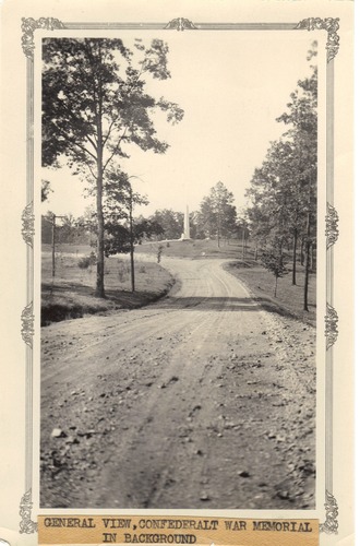 black and white photo of park road and monument