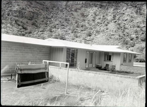 Residence Building 11, with walled patio and brick terrace in back of house.