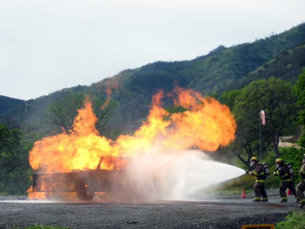 Structure fire burn box training exercise.