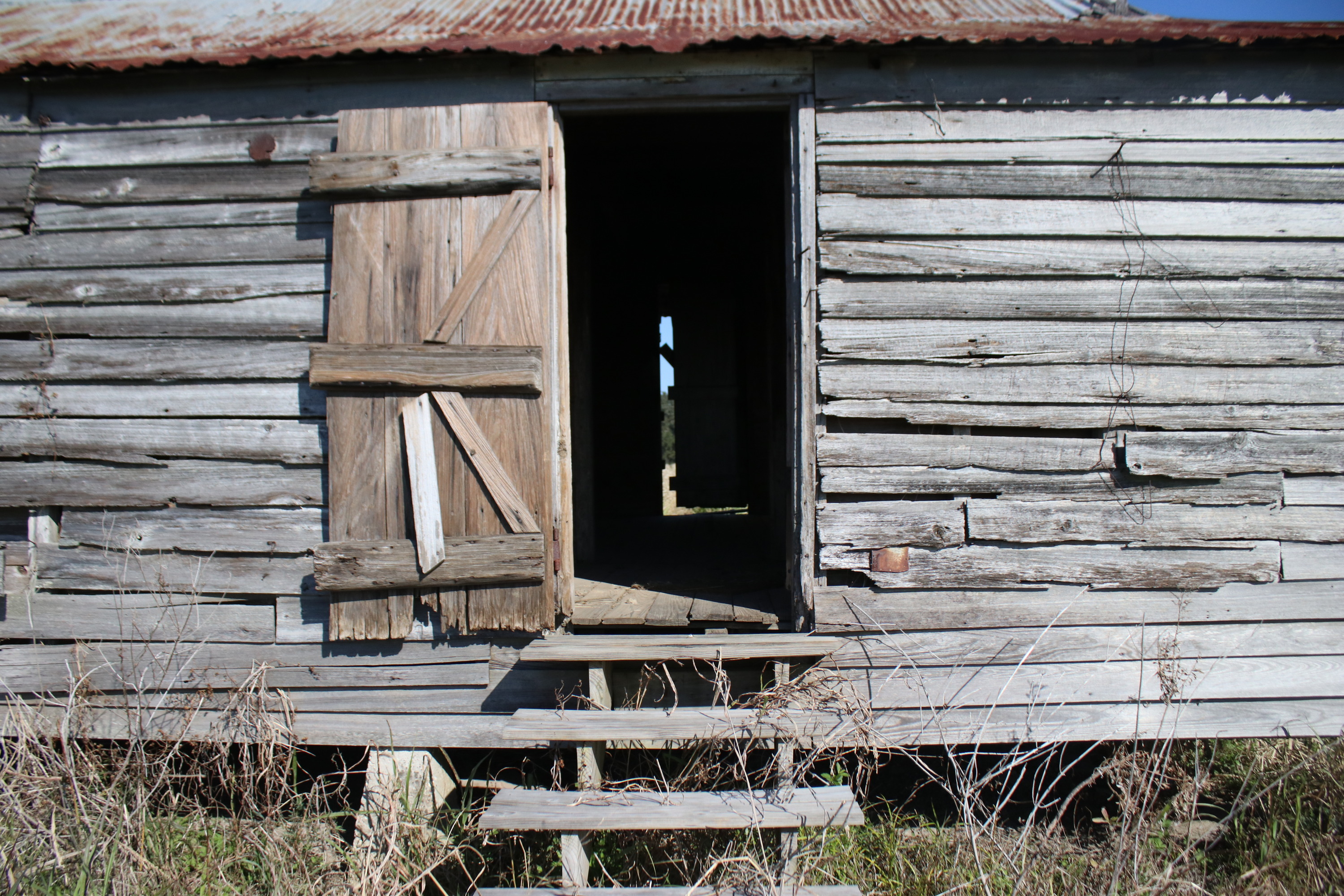 Wooden structure with metal roof.