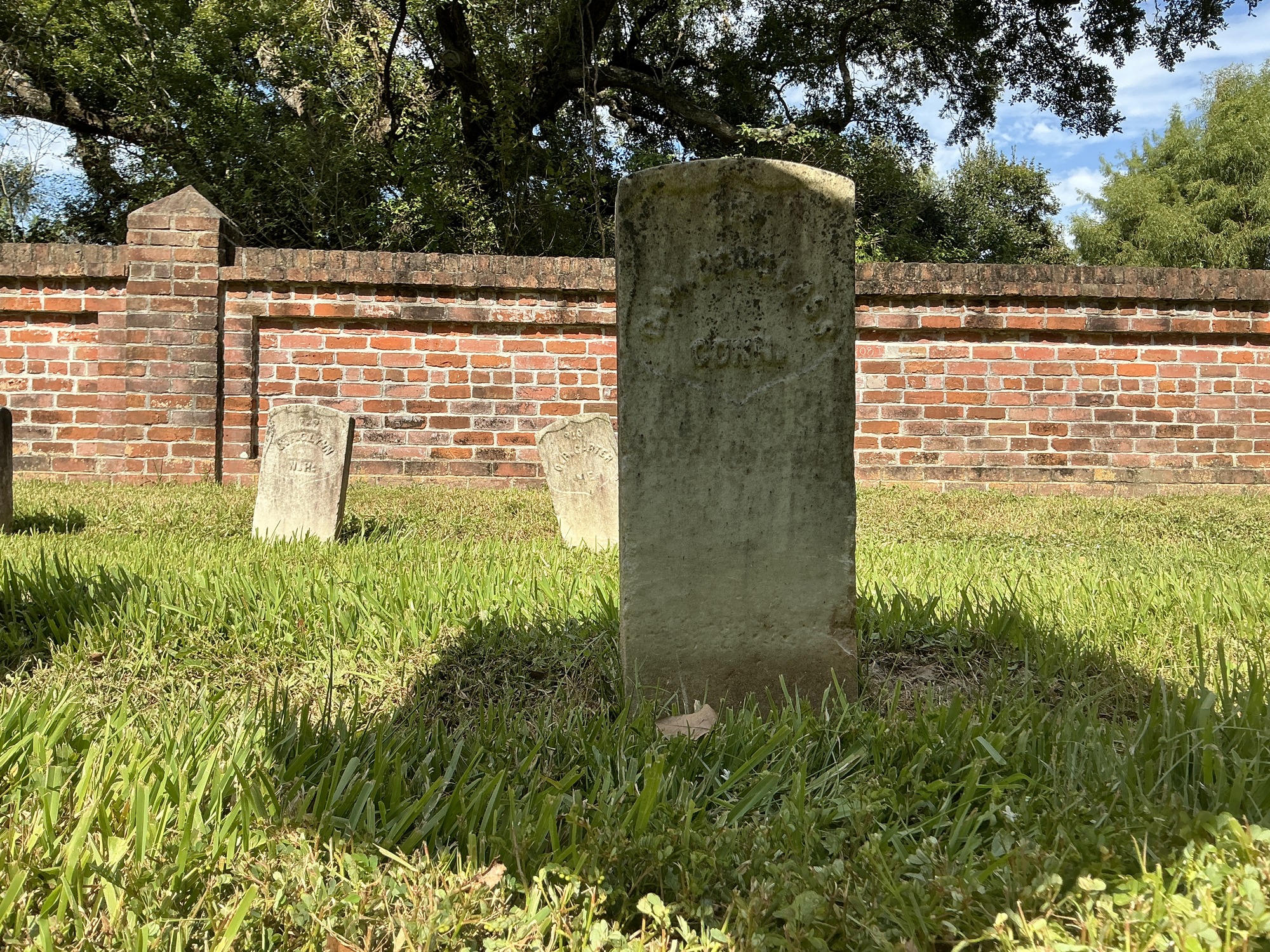 Extra image of historic upright marble headstone with recessed shield face.